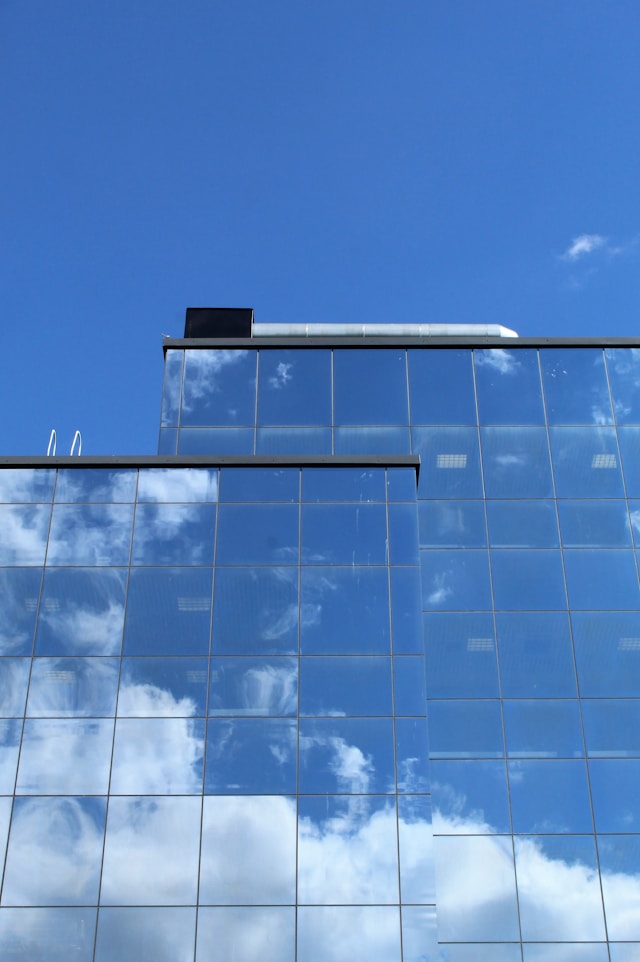 Bulk trademark search, image showing reflection of sky on glass building