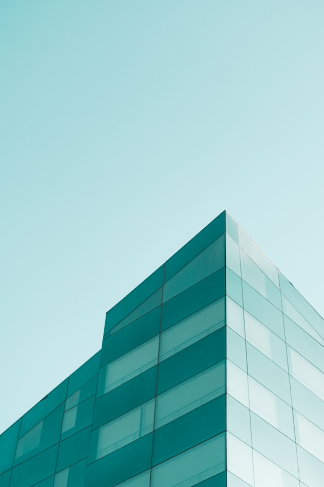Managing IP, project management, image of green building and sky