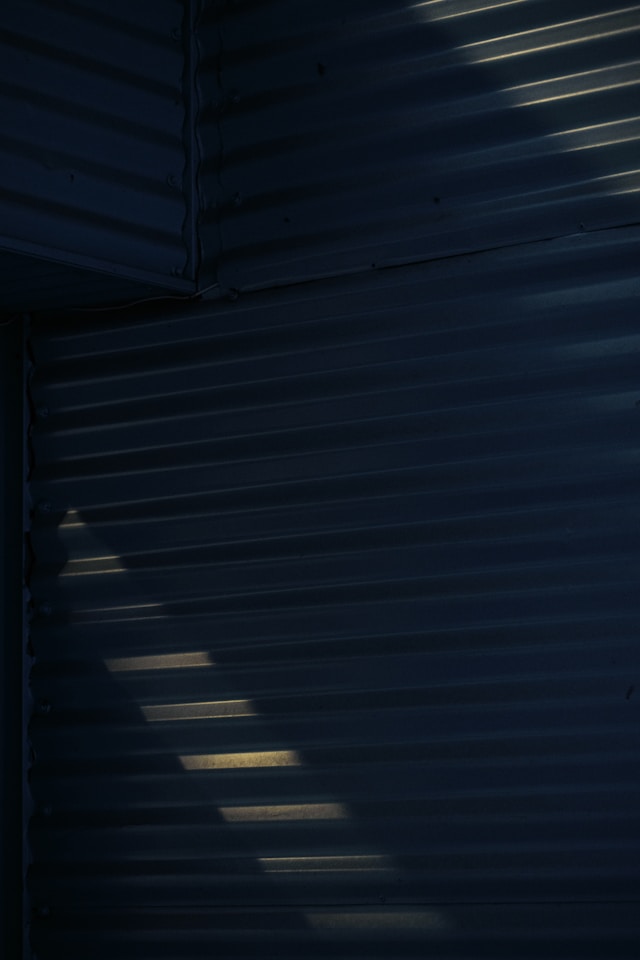 European patent validation services, Questel IP testimonial, BHS Corrugated, image of blue corrugated shutter