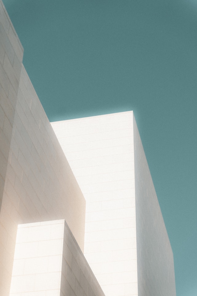 IP docketing system, image of white building against blue sky