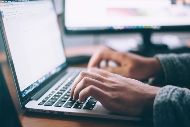 Patent search person using a laptop