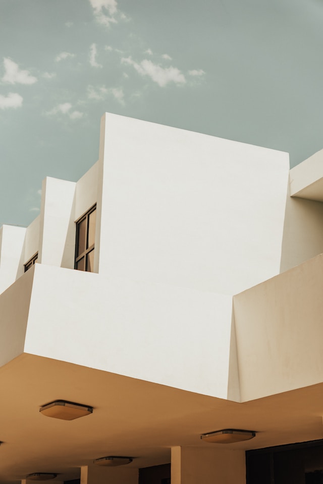 AI for IP management, trademark search, patent drafting, image of building blue sky