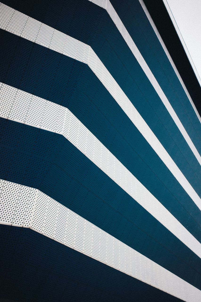 Modern brand protection, impersonators, impersonation protection, image of blue multi-storey building